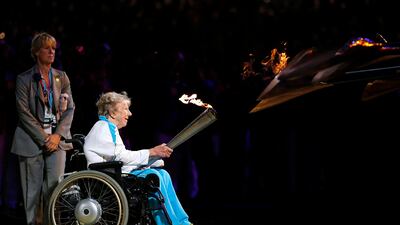 Margaret Maughan, Britain's first Paralympic gold medalist, lights the Paralympic flame during the Opening Ceremony. Matt Dunham/AP