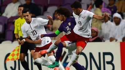 Sardor Rashidov, left, of Qatar's El Jaish club is challenged by Omar Abdulrahman in February. Al Jaish face Al Nasr on Wednesday in the Asian Champions League. AFP