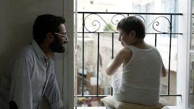 Georges Khabbaz, left, in Ghadi, a film about a boy with Down syndrome, played by Emmanuel Khairallah, right, whose parents devise a fanciful plan to get the village folk to accept their son. Courtesy The Talkies