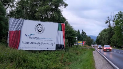 A billboard advertising an Arab tour company organising trips to Poland is pictured on a street in Zakopane