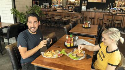 One vegan and her meat-eating husband try the new Impossible burger at Black Tap in Jumeirah Al Naseem. Antonie Robertson / The National