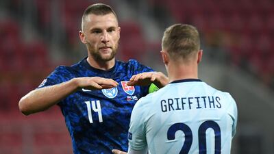 Slovakia's Milan Skriniar, left, and Scotland's Leigh Griffiths shake hands after their Nations League match at City Arena, Trnava, Slovakia. PA