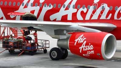 The global downturn has added pressure on AirAsia's long-haul budget business model.