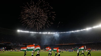 Fireworks go off above Narendra Modi Stadium as India flags are displayed on the pitch after the final. Reuters