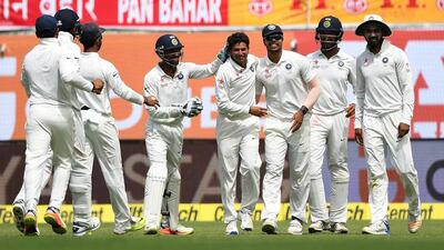 India's Kuldeep Yadav, centre, celebrates the wicket of Australia batsman Glenn Maxwell at Dharamshala on Saturday. Prakash Singh / AFP