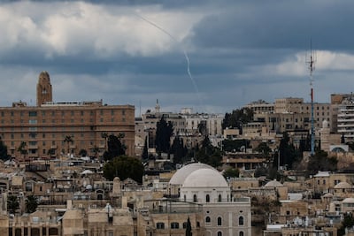 A smoke trail in the sky over Jerusalem after missiles were launched from Iran towards Israel. Reuters