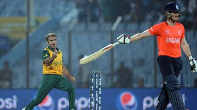 South Africa bowler Imran Tahir celebrates the wicket of England batsman Eoin Morgan during the ICC World Twenty20 tournament cricket match between England and South Africa at The Zahur Ahmed Chowdhury Stadium in Chittagong on March 29, 2014. AFP PHOTO/Prakash SINGH