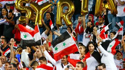 Syria fans cheer on their team from the stands. David Gray / Reuters