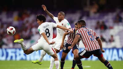 Shoma Doi of Kashima Antlers stretches to control the ball under pressure from Marin. Getty Images
