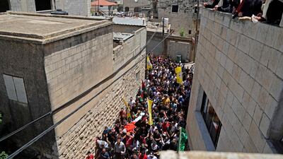 Mourners attend the funeral of Palestinian Rashid Abu Ara, 16, who was killed during clashes with Israeli troops in village of Aqaba near Nablus, north of the West Bank. AFP