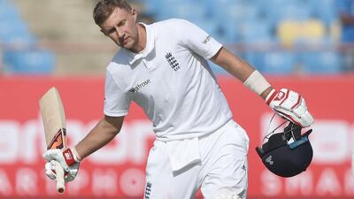 England's Joe Root celebrates after scoring a century on the first day of the first Test against India at the Saurashtra Cricket Association Stadium in Rajkot on November 9 2016. Indranil Mukherjee / AFP