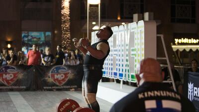 A contestant from the Middle East celebrates after successfully lifting 410 kg.