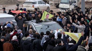 SDF fighters arrive in the city of Qamishli after withdrawing from their stronghold of Aleppo. Reuters