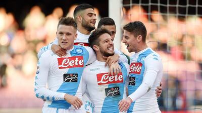 Dries Mertens, front centre, is congratulated for a goal during the Serie A match between Napoli and Torino at Stadio San Paolo on December 18, 2016 in Naples, Italy. Francesco Pecoraro / Getty Images