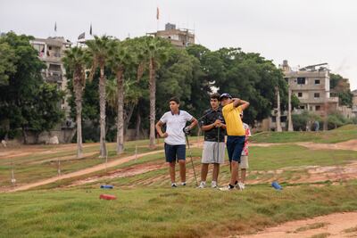 A group of young players tee off at the Golf Club of Lebanon, which has enrolled about 30 students to learn the game through its school outreach programme. Matt Kynaston / The National