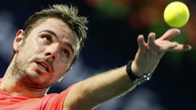 Stan Wawrinka of Switzerland serves to Philipp Kohlschreiber of Germany during their ATP tennis match at Dubai Duty Free Tennis Championships February 25, 2016. REUTERS/Ahmed Jadallah