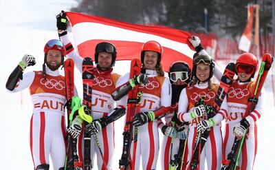 Silver medallists Austria with Marco Schwarz, Michael Matt, Manuel Feller, Katharina Liensberger, Katharina Gallhuber and Stephanie Brunner celebrate during the victory ceremony for the Alpine Team Event Big Final on Day 15 of the PyeongChang 2018 Winter Olympic Games at Yongpyong Alpine Centre. Ezra Shaw / Getty Images
