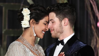 Newlyweds Priyanka Chopra, 36, and Nick Jonas, 26, pose for a photograph during a reception at a hotel in New Delhi on December 4, 2018. Photo: EPA