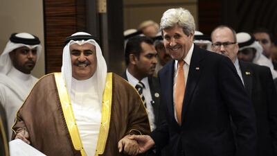Bahrain's foreign affairs minister Sheikh Khaled bin Ahmed Al Khalifa (L) and US secretary of state John Kerry arrive for a press conference in the capital Manama on April 7, 2016. Mohammed Al Shaikh/AFP