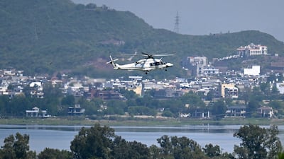 A helicopter flies over Islamabad, where preparations have been made for a second round of US-Iran peace talks. AFP