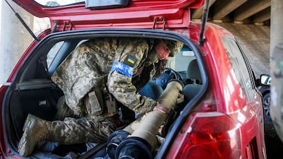 Tetiana Chornovol, a former Ukrainian MP, prepares to take position with an anti-tank missile on the front line in the Kyiv region. Reuters