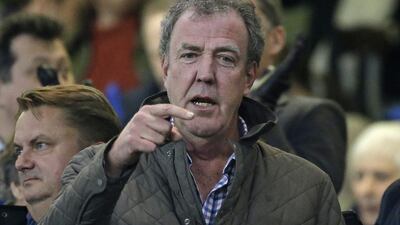 TV host Jeremy Clarkson gestures as he takes his place in the stands before a football match between Chelsea and Paris Saint Germain at Stamford Bridge stadium in London on March 11, 2015. Matt Dunham/AP Photo