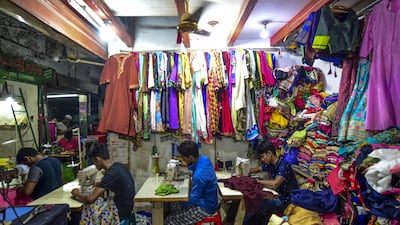Bangladeshi tailors work ahead of Eid Al Fitr in Dhaka. AFP