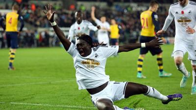Bafetimbi Gomis of Swansea City celebrates after scoring the winner in a 2-1 victory against Arsenal on Sunday in the Premier league at the Liberty Stadium in Swansea. Dimitris Legakis / EPA