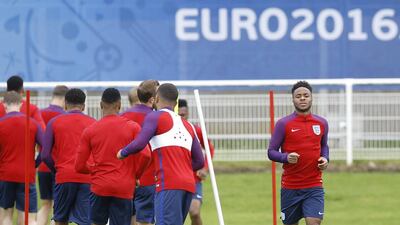 England’s Raheem Sterling, right, runs during a training session in Chantilly, France, Sunday, June 19, 2016. England will face Slovakia in a Euro 2016 Group B soccer match in Saint-Etienne on Monday, June 20. (AP Photo/Kirsty Wigglesworth)