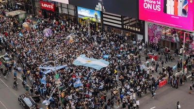 People celebrate after Argentina's World Cup win at Times Square in New York City. AFP