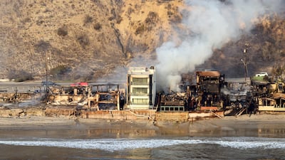 Burnt homes smoulder after the Palisades fire in the coastal community of Malibu in Los Angeles county. AFP