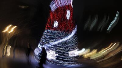 People walk past a Christmas tree in central Sofia, Bulgaria. REUTERS
