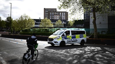 A police van outside the offices of Iran International in London. Three British citizens will go on trial over an attempted firebombing of its headquarters. AFP