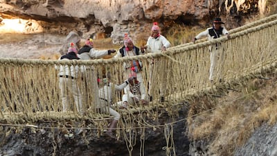Members of the Huinchiri community repair the Q’eswachaka hanging bridge, which crosses the Apurimac River in Quehue, Peru. The rope walkway was built by the Incas more than 500 years ago and the skills associated with maintaining it were added to Unesco’s Intangible Cultural Heritage of Humanity list in 2013. The bridge took three months to restore after it fell into disrepair during the Covid-19 pandemic. AFP