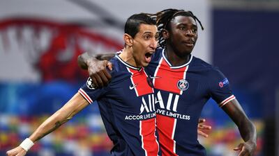 Paris St Germain's Angel Di Maria celebrates scoring their first goal with Moise Kean. Reuters
