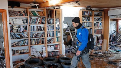 An Israeli policeman walks inside the synagogue in Amona where hardline settlers and their supporters had barricaded themselves before being evicted on February 2, 2017. Thomas Coex / AFP