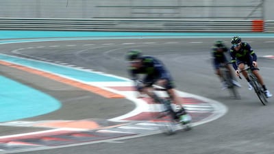 Members of the Movistar Team train on the Yas Marina Circuit.