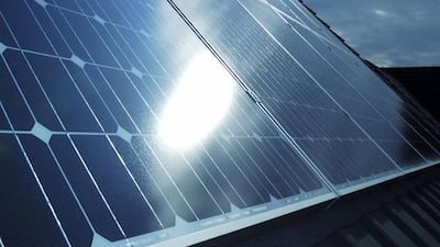 Photovoltaic solar panels on a home roof. A new scheme from Dubai Electricity and Water Authority means homeowners and businesses can now connect their solar panels to the electricity grid. iStockphoto.com