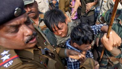 Police officers try to detain demonstrators during a protest against the Citizenship Amendment Bill, that seeks to give citizenship to religious minorities persecuted in neighbouring Muslim countries, in Agartala, India, December 11, 2019. Reuters