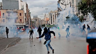Lebanese anti-government protesters clash with security forces near the Serail (headquarters of the Governorate), in the northern port city of Tripoli, during a demonstration to protest against the economic situation. AFP