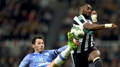Adam Smith of Bournemouth battles for the ball with Newcastle's Allan Saint-Maximin. Getty