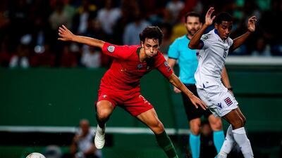 Portugal's forward Joao Felix (L) vies with Luxembourg's midfielder Leandro Barreiro during the Euro 2020 qualifier group B football match between Portugal and Luxembourg at the Jose Alvalade stadium in Lisbon. AFP