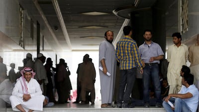 Migrant workers, who work for Saudi Binladin Group, gather as they ask for a final settlement over a salary issue, in Riyadh on March 29, 2016. Faisal Al Nasser / Reuters