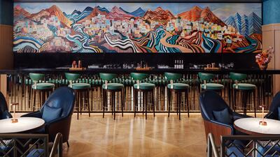 Artwork of the Mutrah neighbourhood in Muscat hangs in the cigar lounge