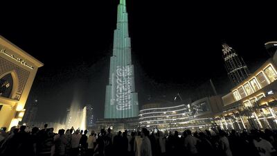 Burj Khalifa lights up in the colours of Saudi Flag - Saudi Arabia's non-oil private sector economy has maintained growth momentum in October. Satish Kumar / The National