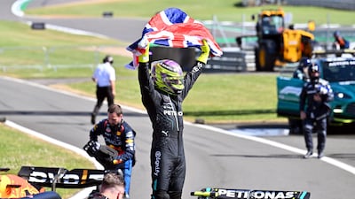 Mercedes driver Lewis Hamilton celebrates after winning the British Grand Prix. EPA