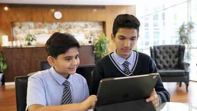 Arham Jain, left, and Muhammed Hafesjee at Gems Modern Academy in Dubai, where some exams have been dropped for middle-school pupils. Pawan Singh / The National