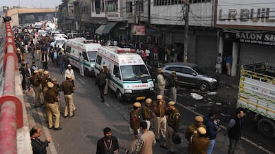 Police personnel and ambulances are seen along a road following a factory fire in Anaj Mandi area of New Delhi. At least 43 people have died in a factory fire in India's capital New Delhi. AFP