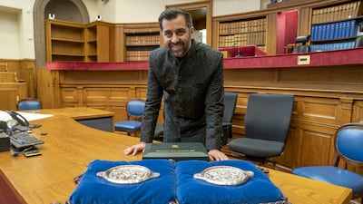 Mr Yousaf poses with the Great Seal of Scotland after being sworn in