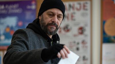 A voter casts his ballot at a polling station in Zagreb. AFP